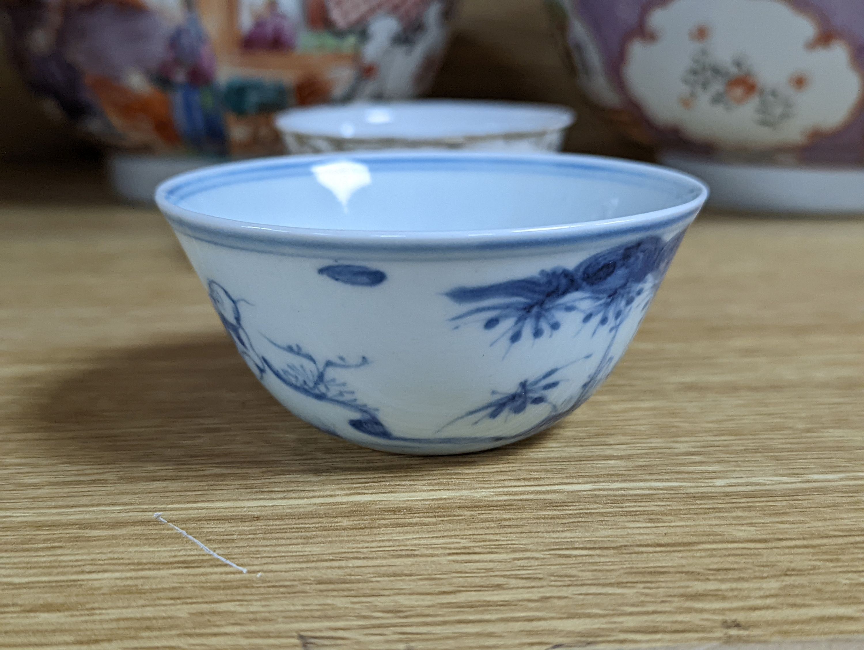 Two 18th century Chinese export bowls, a similar tea bowl and another Chinese blue and white tea bowl, largest 20cm diameter